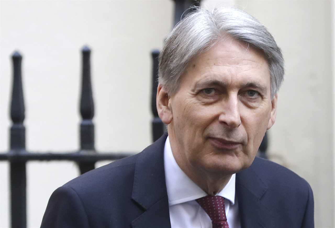 FILE - In this file photo dated Wednesday, April 10, 2019, Britain's Chancellor of the Exchequer Philip Hammond in Downing Street in London. Hammond, who stepped down as Treasury chief before Boris Johnson became prime minister, has broken his silence on the new administration in an article published in The Times of London Wednesday Aug. 14, 2019, saying Britain is being pushed towards a no-deal Brexit by "unelected people". (AP Photo/Kirsty Wigglesworth, FILE)