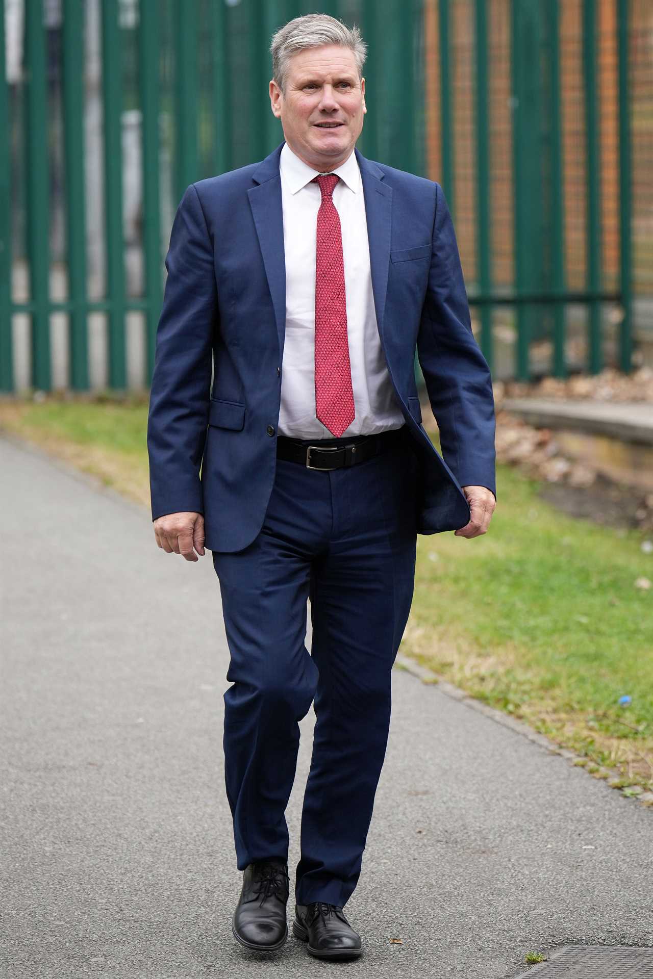 LIVERPOOL, ENGLAND - JULY 25: Keir Starmer, leader of the Labour Party, arrives at the Anfield Sport & Community Centre to meet players and staff during the weekly training session of the walking football team on July 25, 2022 in Liverpool, England. Earlier the labour leader delivered a keynote speech on the economy at The Spine Building. (Photo by Christopher Furlong/Getty Images)