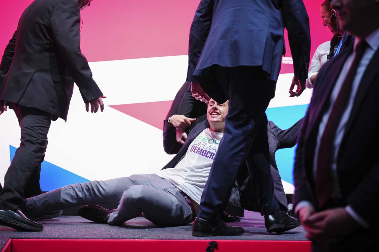 Dramatic moment protester interrupts Sir Keir Starmer's Labour conference speech with glitter attack