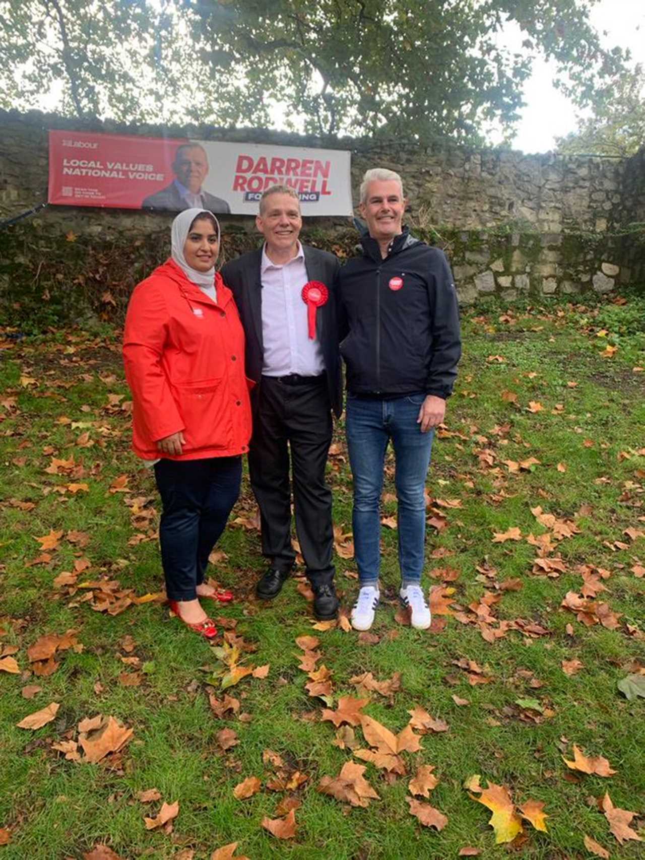 Fury as Labour candidate criticized for using gravestones to hang election campaign banner