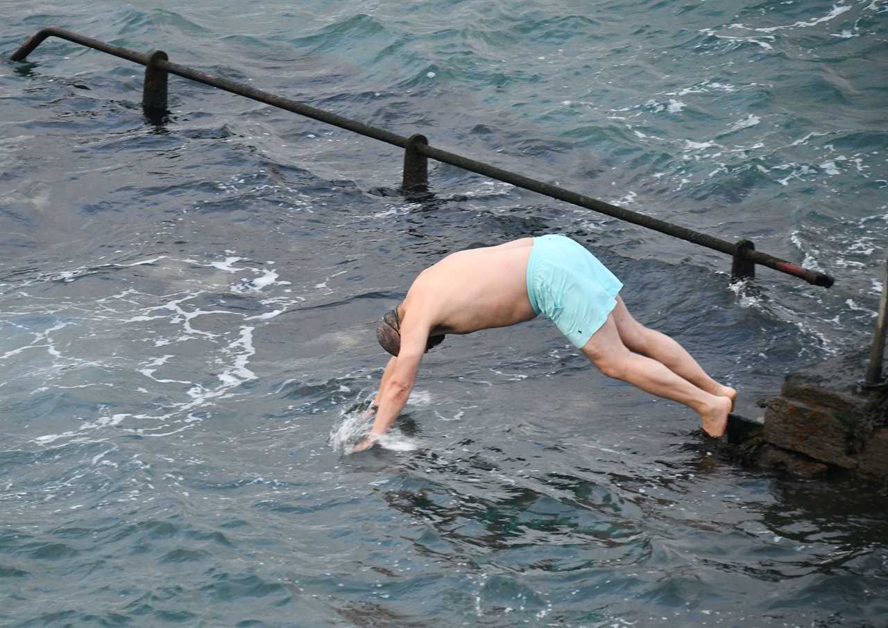 Home Secretary James Cleverly and Tory MP Johnny Mercer take a dip in the sea to connect with voters