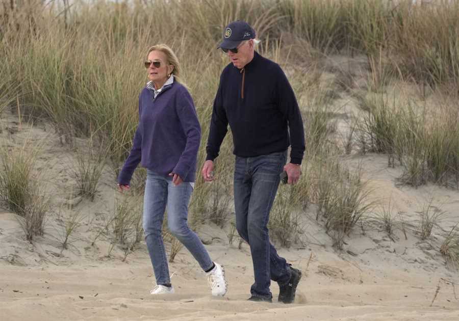 Joe Biden stumbles on sandy beach during day out in Delaware