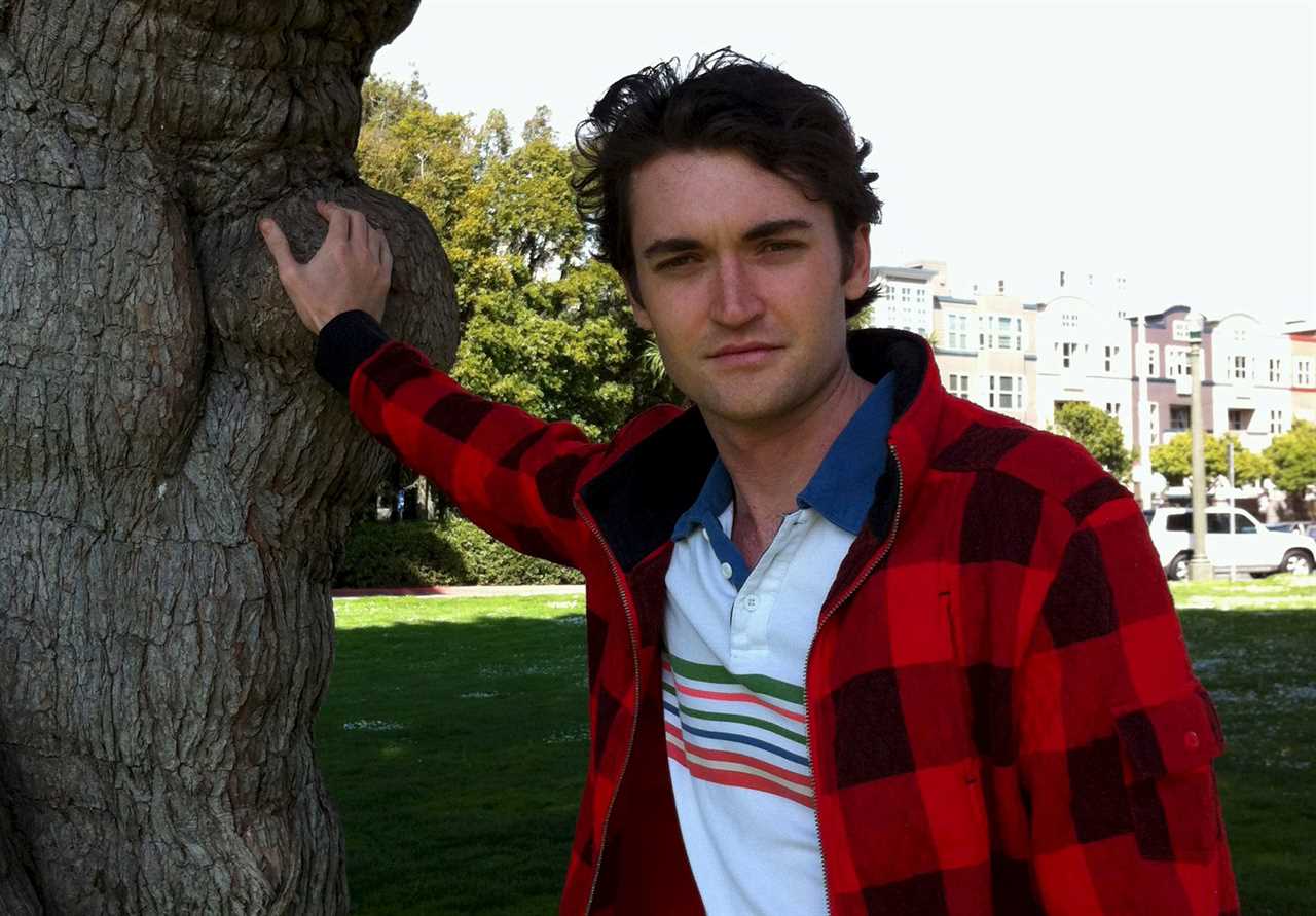 Ross Ulbricht, touching a tree.